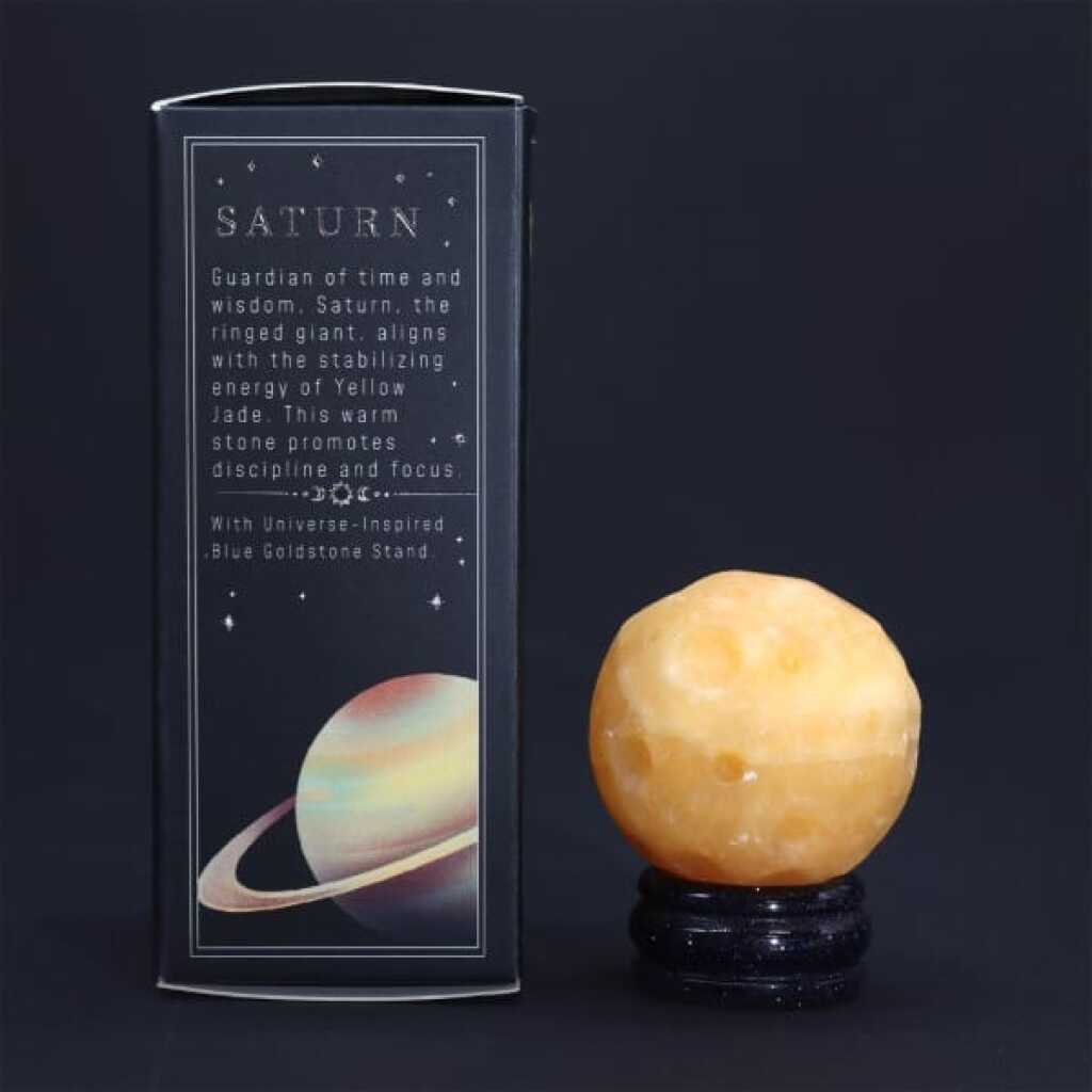 a yellow jade gemstone planet representing saturn with packaging