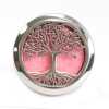 An aromatherapy diffuser for the car, in the shape of the tree of life