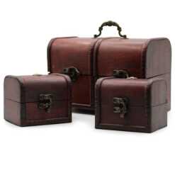 A set of three classic chests, described as replica antiques with brass fittings