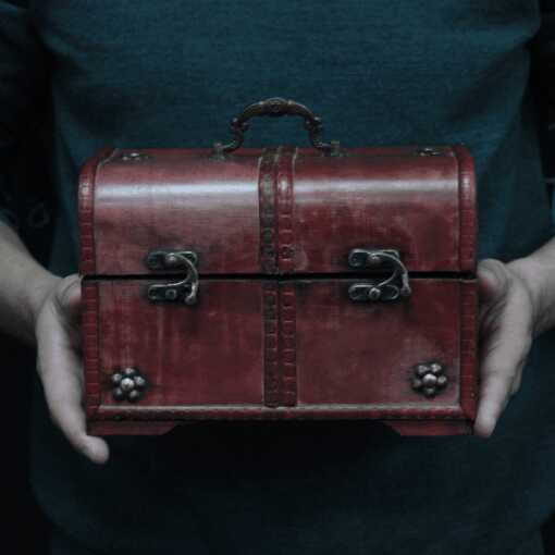 One of a set of three classic chests, described as replica antiques with brass fittings