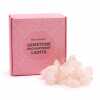 A set of rose quartz gemstone enchantment lights, with packaging