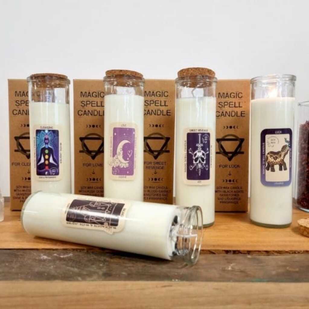 5 magic spell candles on a shelf