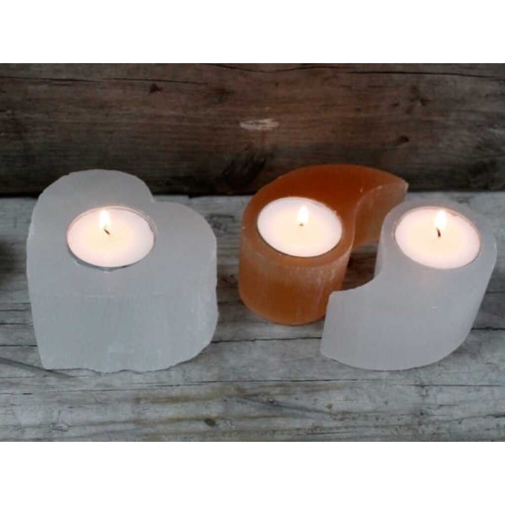 a set of three selenite ying yang candle holders