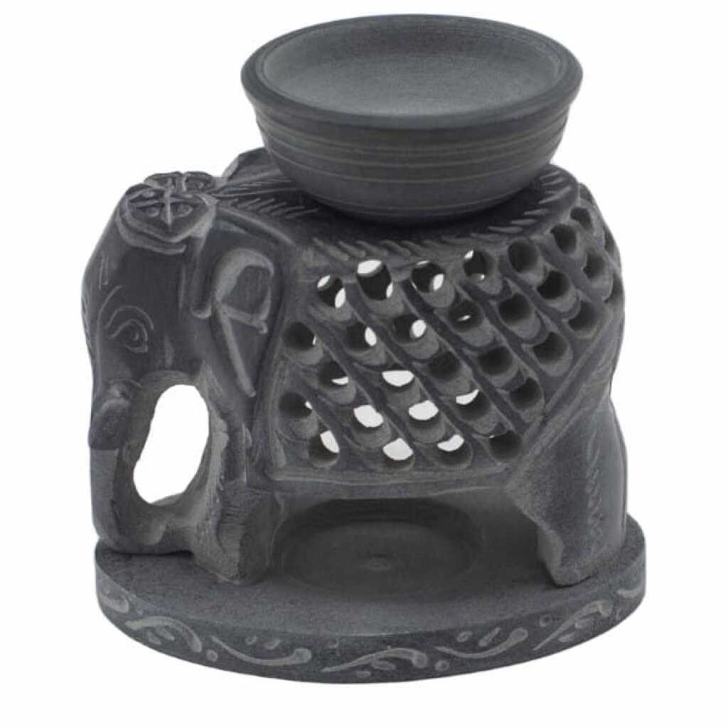 a large, graceful, soapstone elephant oil burner