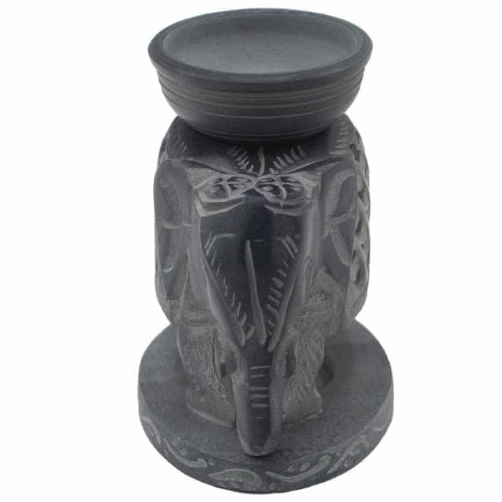 a large, graceful, soapstone elephant oil burner