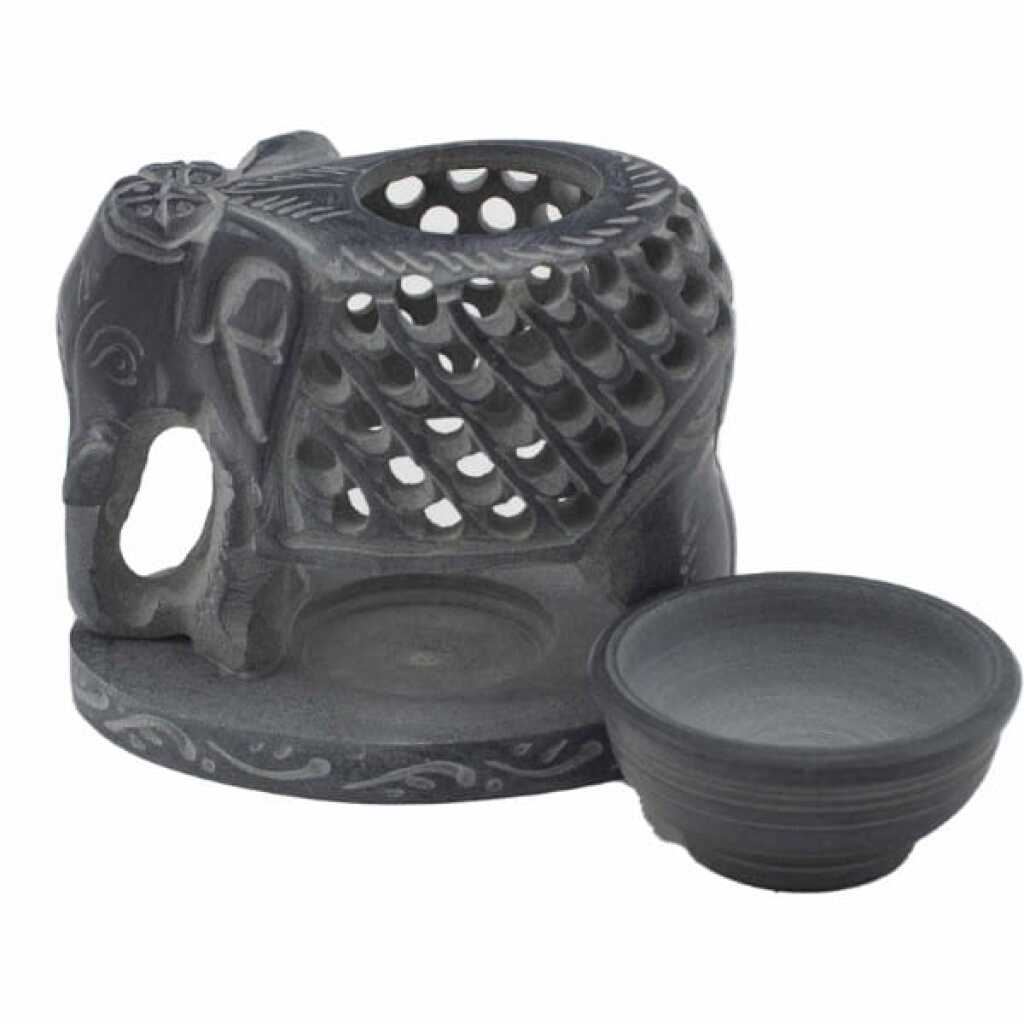 a large, graceful, soapstone elephant oil burner