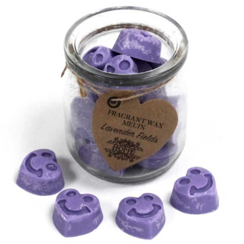 a jar of soy wax melts with four in front - lavender fields