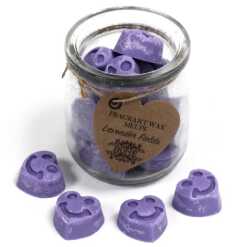 a jar of soy wax melts with four in front - lavender fields