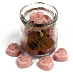 a jar of soy wax melts with four in front - peachy cool