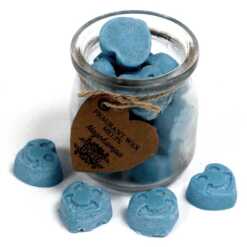 a jar of soy wax melts with four in front - nagchampa