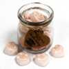 a jar of soy wax melts with four in front - vanilla nutmeg