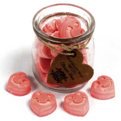 a jar of soy wax melts with four in front - classic rose