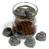 a jar of soy wax melts with four in front - dark patchouli