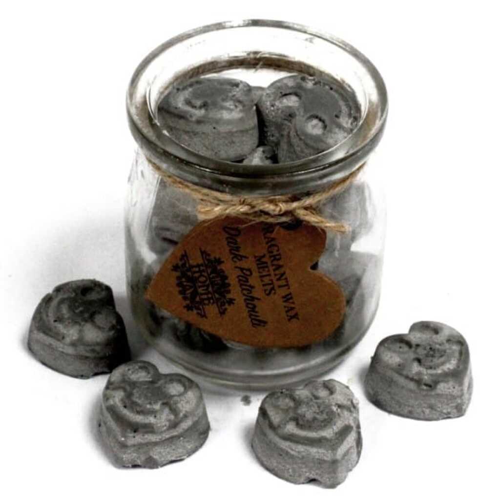 a jar of soy wax melts with four in front - dark patchouli
