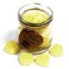 a jar of soy wax melts with four in front - banana rush