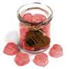 a jar of soy wax melts with four in front - tuberose