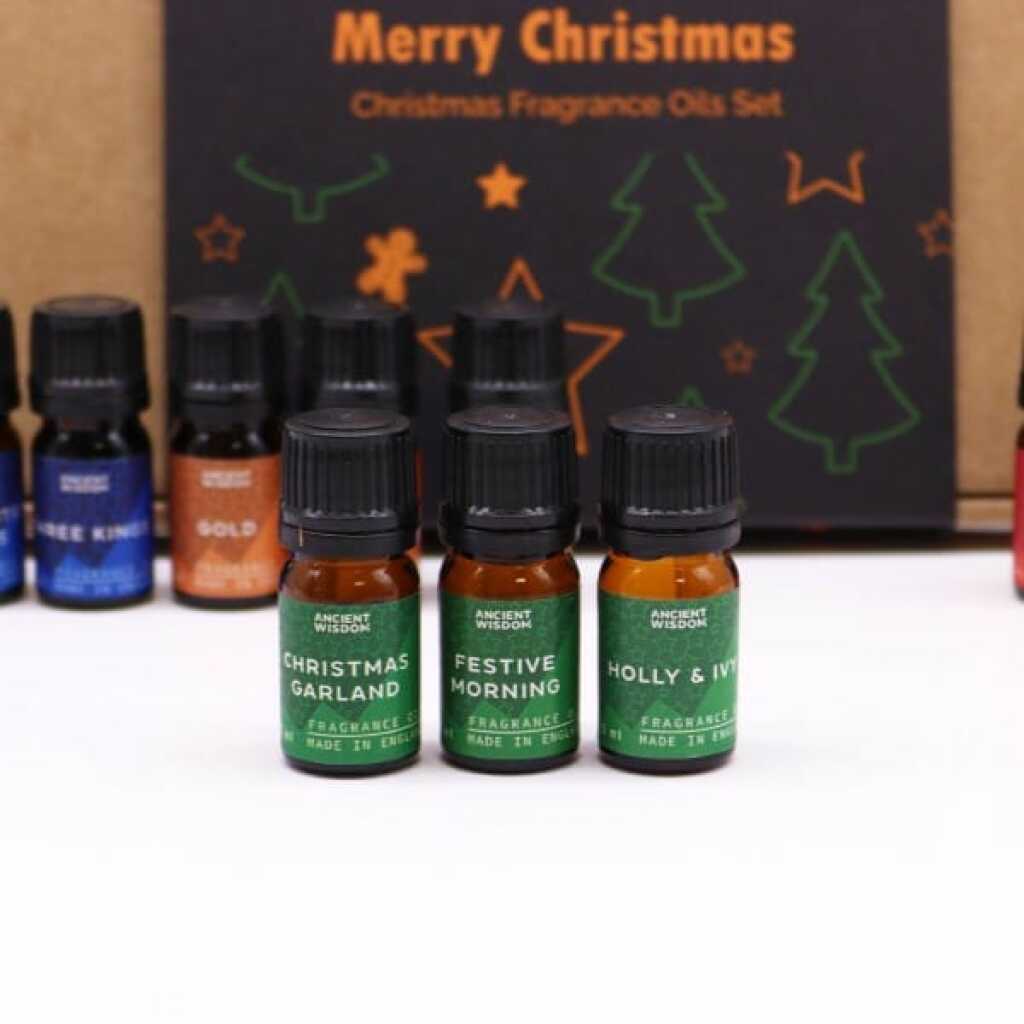 three bottles from the holy scents of christmas fragrance oil set