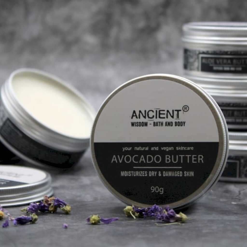 a black and white tin of pure body butter with a stack of tins in the background.