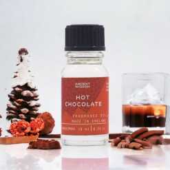 a 10ml clear bottle of Hot Chocolate fragrance oil in a christmas setting