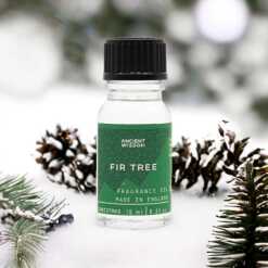 a 10ml clear bottle of Fir Tree fragrance oil in a christmas setting