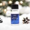 a 10ml clear bottle of White Christmas fragrance oil in a christmas setting