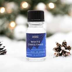a 10ml clear bottle of White Christmas fragrance oil in a christmas setting