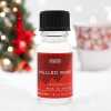 a 10ml clear bottle of Mulled Wine fragrance oil in a christmas setting