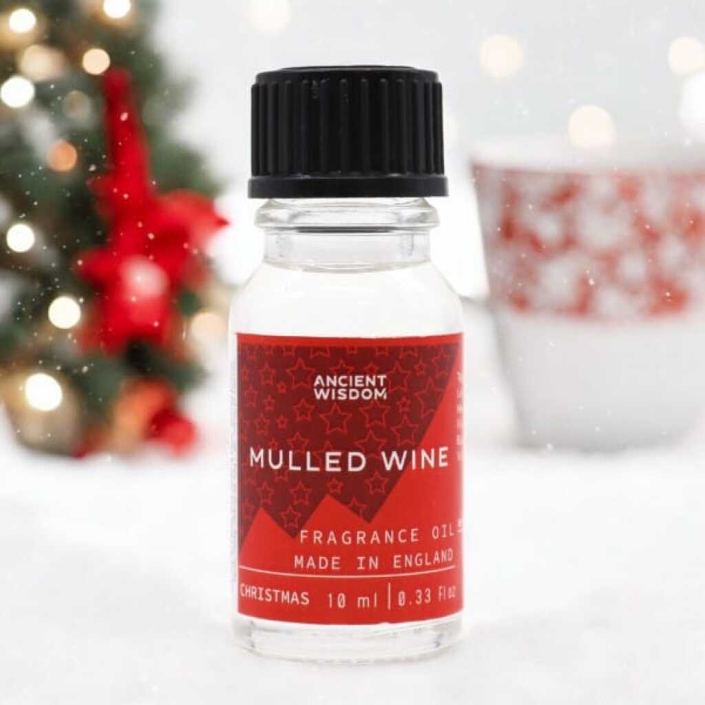 a 10ml clear bottle of Mulled Wine fragrance oil in a christmas setting