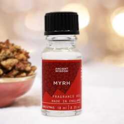 a 10ml clear bottle of Myrrh fragrance oil in a christmas setting