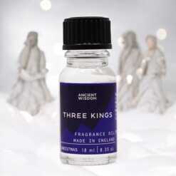 a 10ml clear bottle of Three Kings fragrance oil in a christmas setting