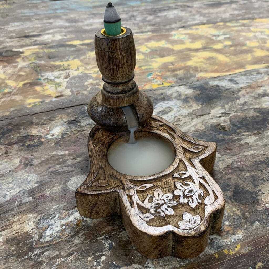 a mango wood backflow burner with incense cone and smoke