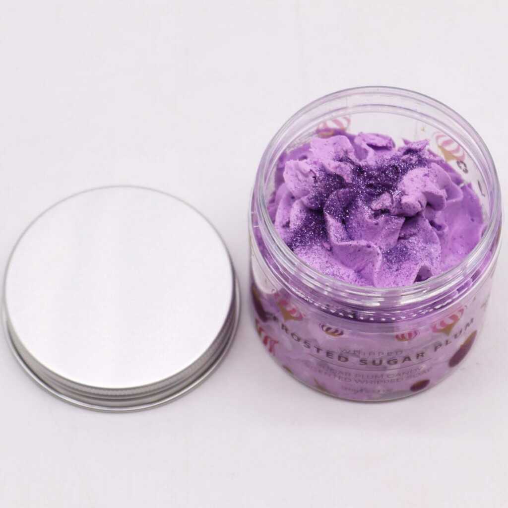 an open jar of Frosted Sugar Plum whipped soap, with lid
