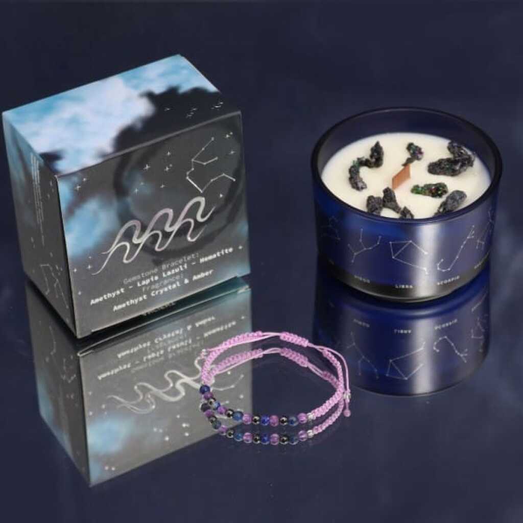 a zodiac candle with crystals and a gemstone bracelet - aquarius