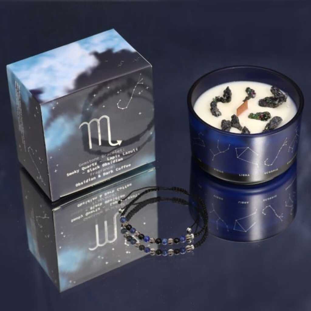 a zodiac candle with crystals and a gemstone bracelet - scorpio