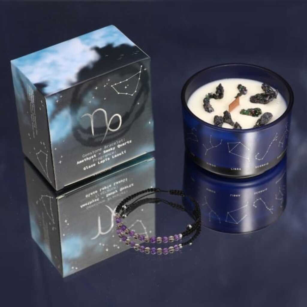 a zodiac candle with crystals and a gemstone bracelet - capricorn
