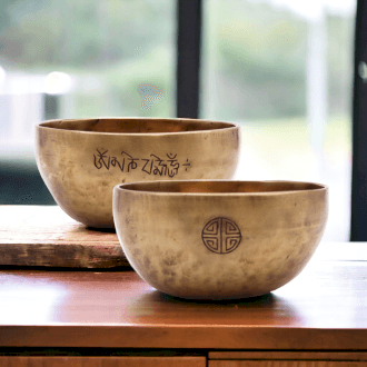 A pair of Tibetan Singing Bowls on a table top