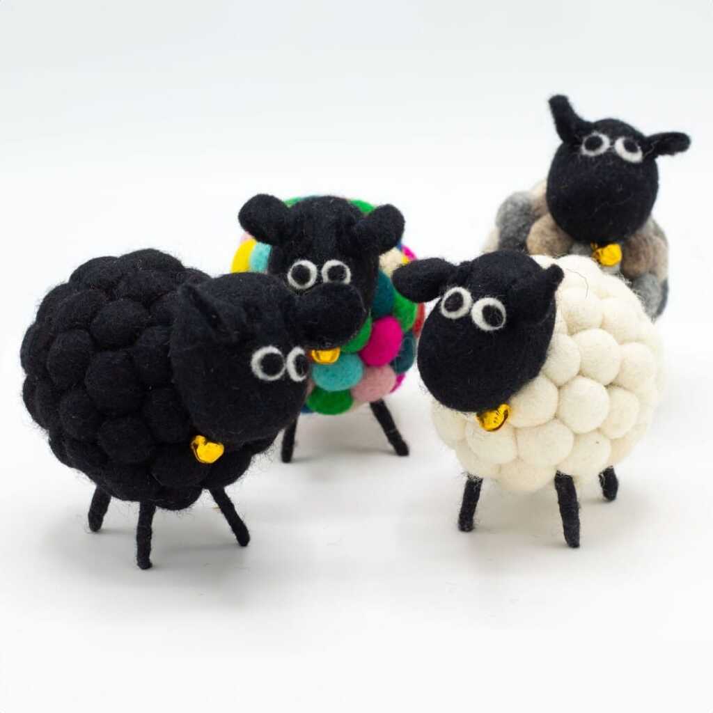 a herd of different coloured felt sheeps