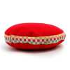A 7cm, red velvet singing bowl cushion.