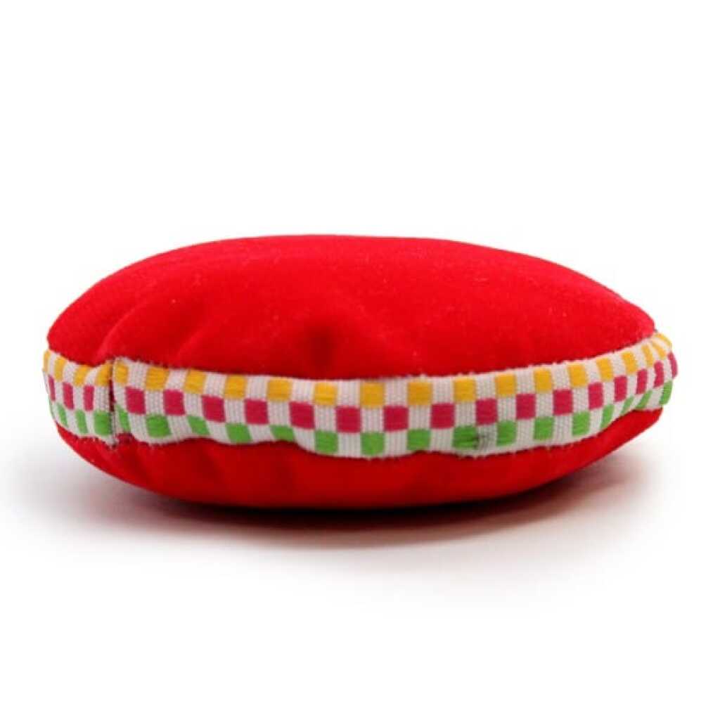 A 7cm, red velvet singing bowl cushion.