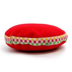 A 7cm, red velvet singing bowl cushion.