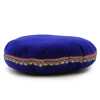 A 16cm, blue velvet singing bowl cushion.
