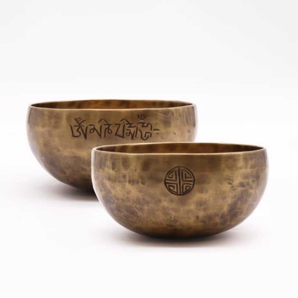 Two medium brass Nepalese Moon Singing Bowls