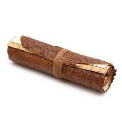 A rolled leather travel notebook, rolled up