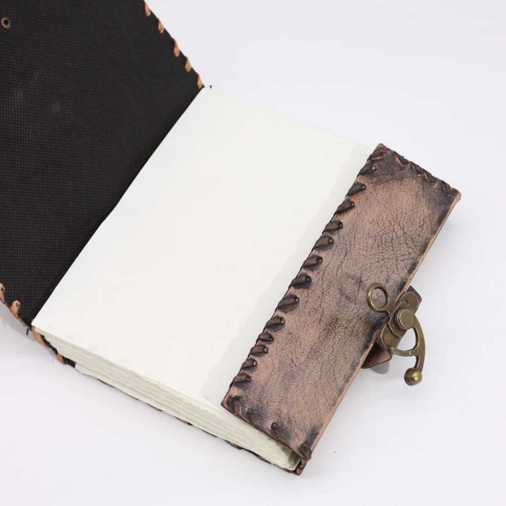 A stunning Brown Tan Book with Evil Eye Design - pages open