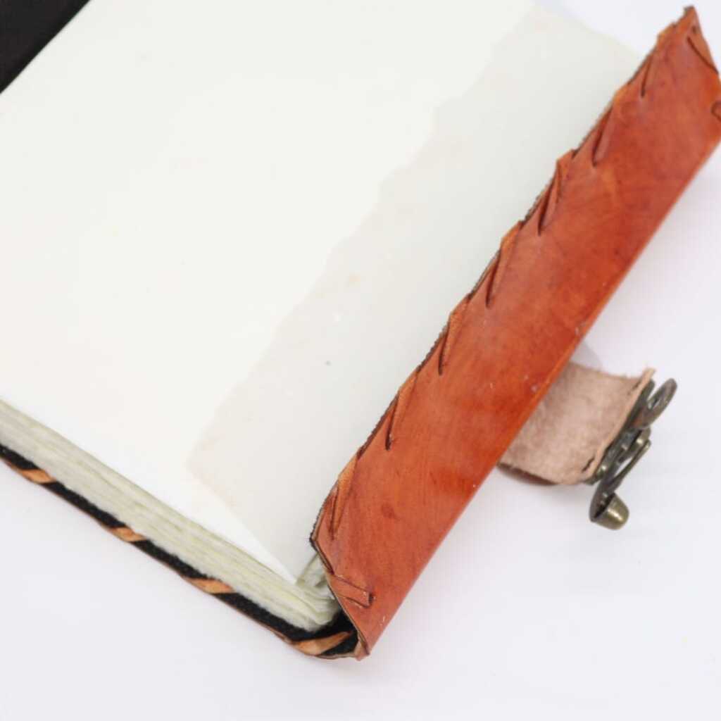 A stunning Light Brown Tan Book with Evil Eye Design - pages open