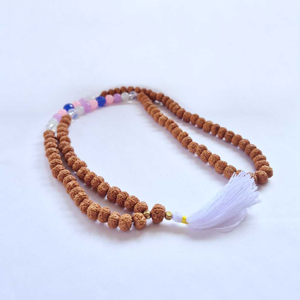 a Bali Mala Necklace with 108 Rudraksha beads and a tassel