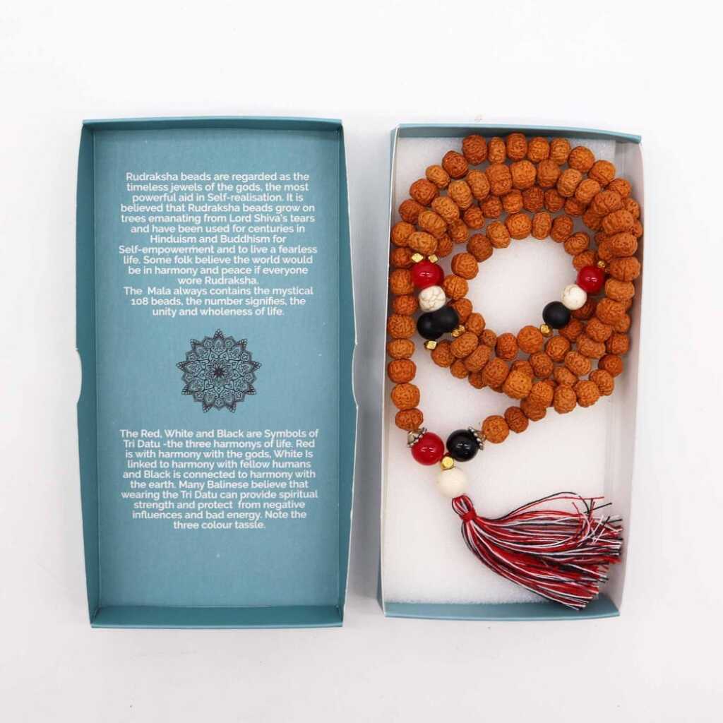 a Bali Mala Necklace with 108 Rudraksha beads and a tassel, in its box