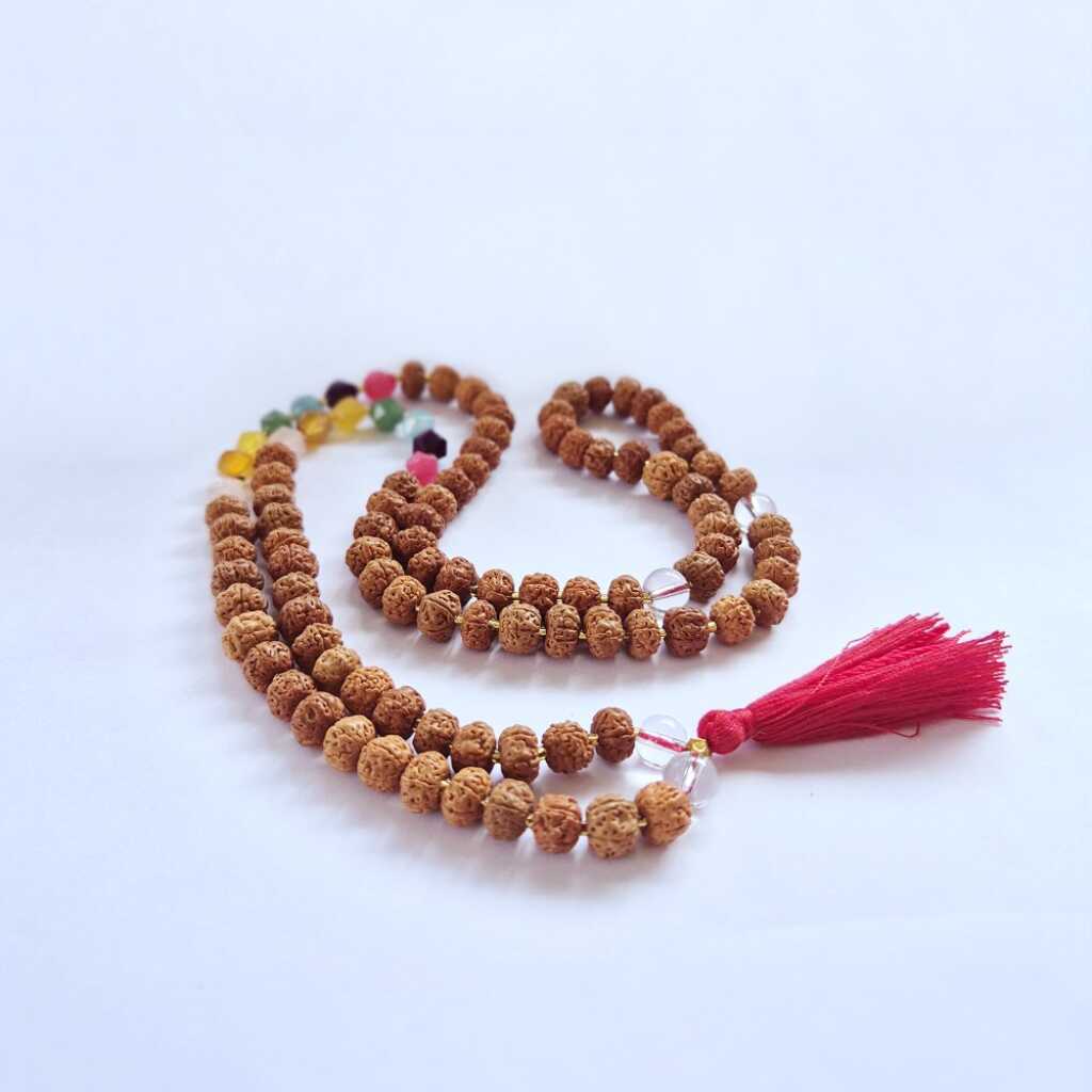 a Bali Mala Necklace with 108 Rudraksha beads and a tassel