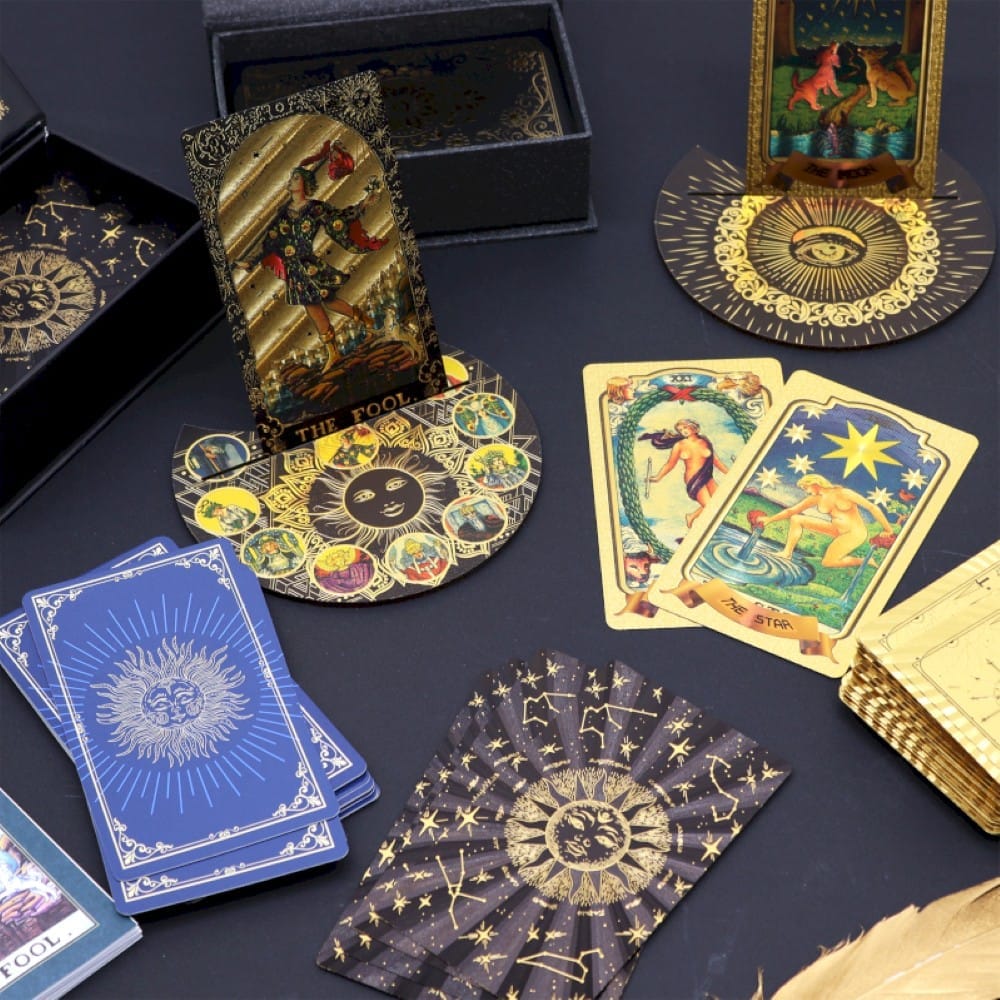 A selection of Tarot Card decks on a dark table cloth