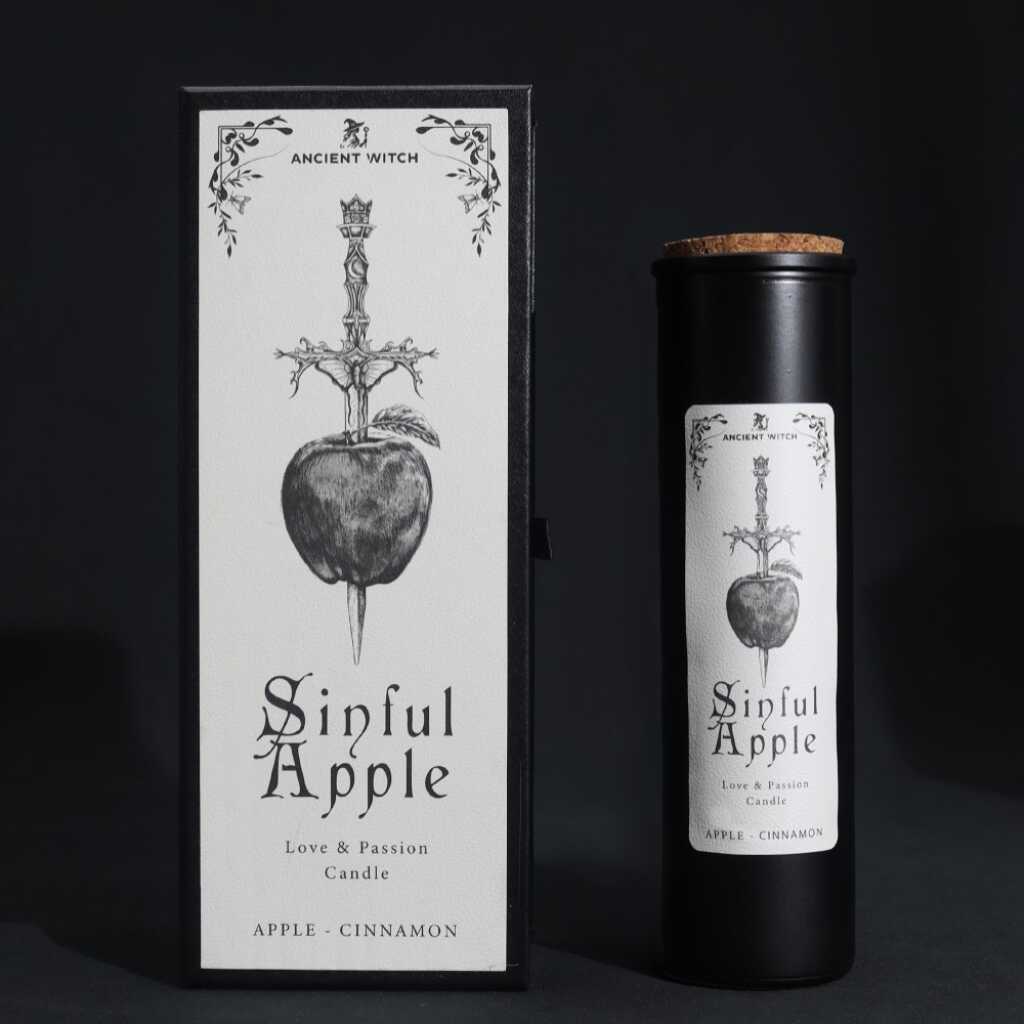 an ancient witch ritual candle with packaging on a dark background